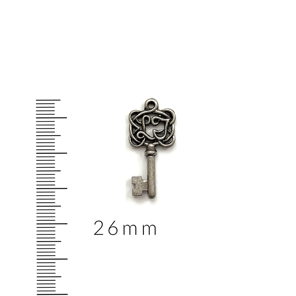 alt="antique pewter key charm"