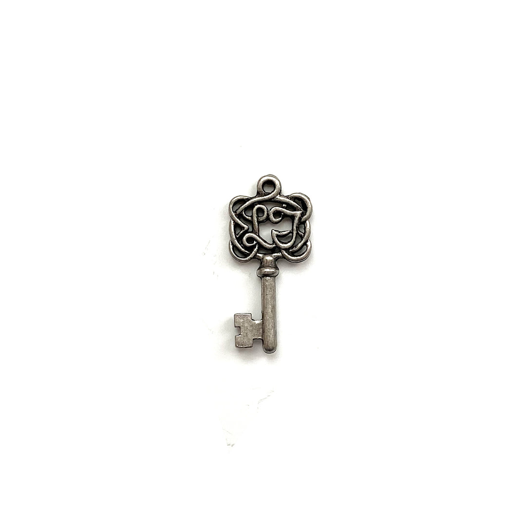 alt="antique pewter key charm"