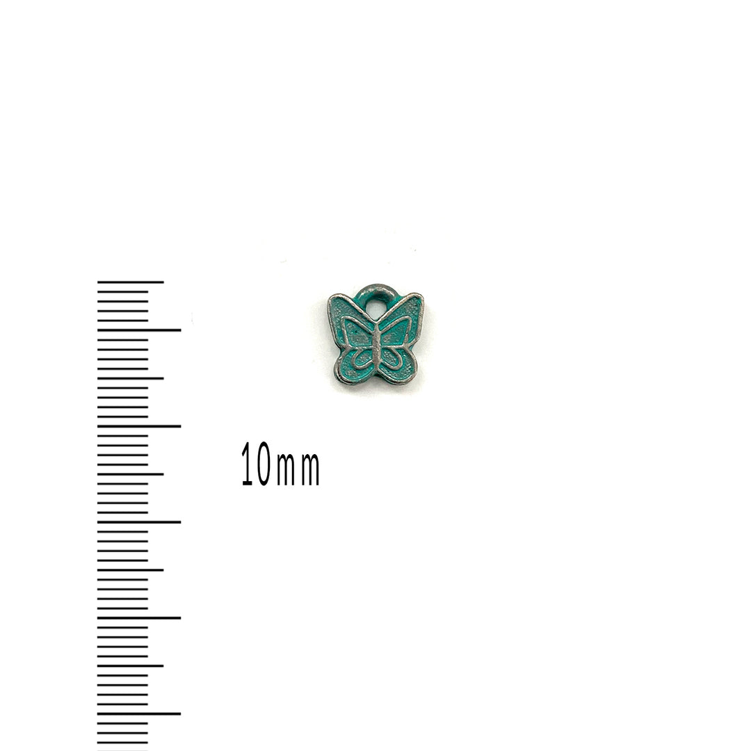 alt="artisan verdigris butterfly charm"