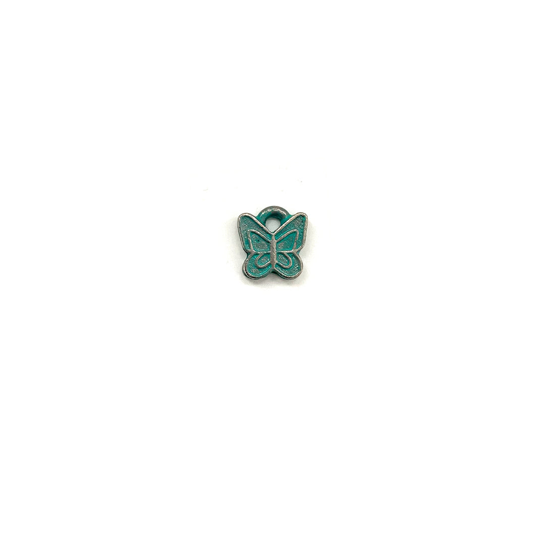 alt="artisan verdigris butterfly charm"