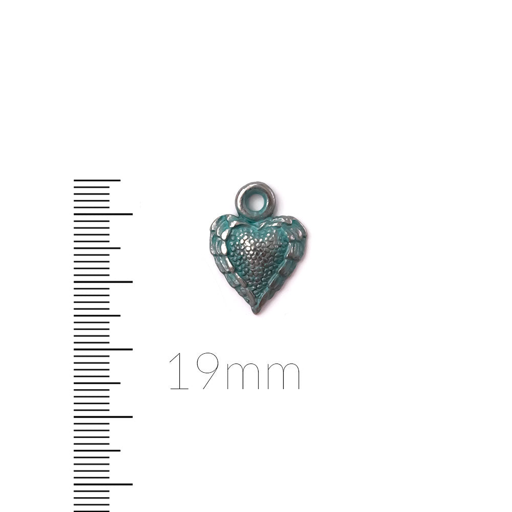 alt="artisan verdigris textured heart charm"