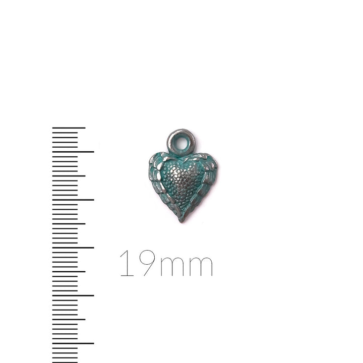 alt="artisan verdigris textured heart charm"