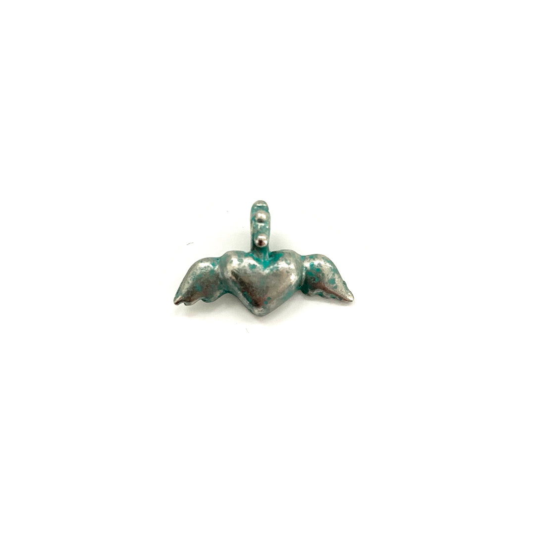 alt="artisan verdigris winged heart charm"