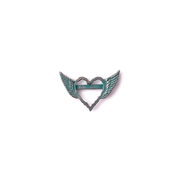 alt="artisan verdigris winged heart connector"